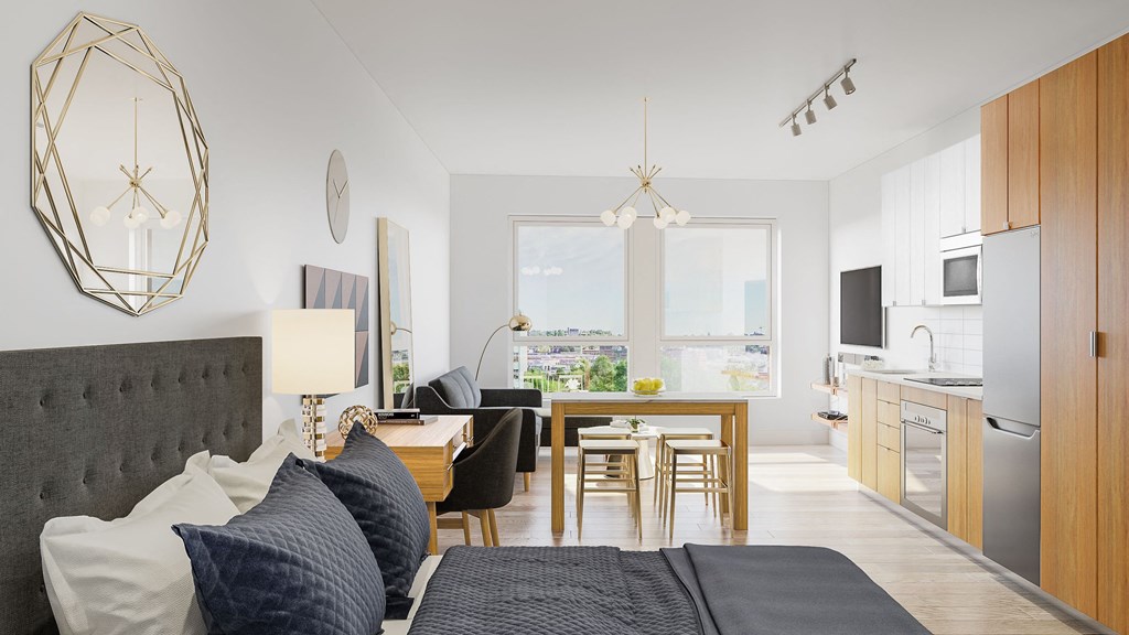 a living room and kitchen with a couch and a table