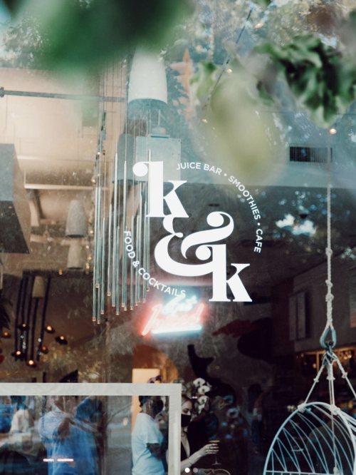 a window of a restaurant with a logo on it