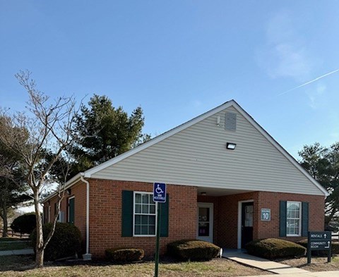 A small building with a sign on the front.