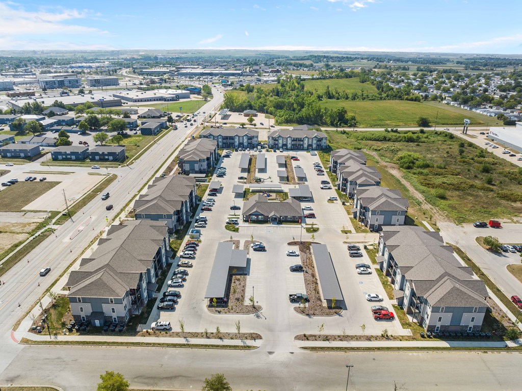 an aerial view of a row of houses with cars parked in front of them  at Union at Wiley, Iowa