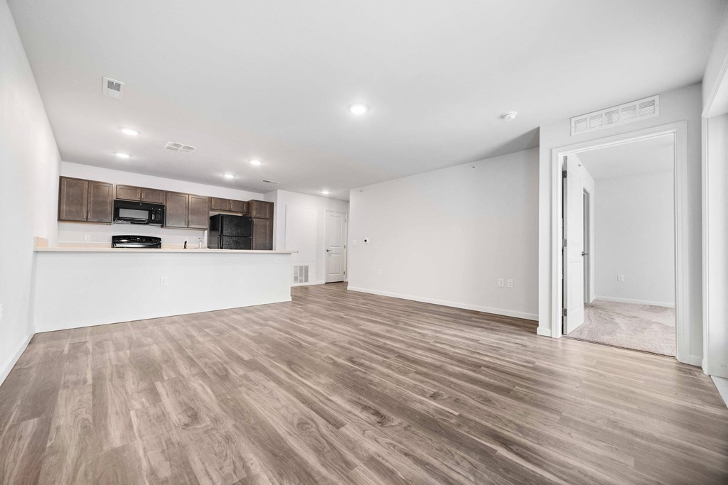 the living room and kitchen in a 555 waverly unit  at Union at Wiley, Cedar Rapids, 52404