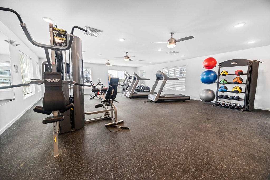 a workout room with treadmills and other exercise equipment  at Union at Wiley, Cedar Rapids, 52404