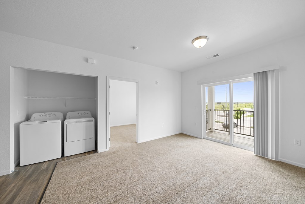 A laundry room with a washer and dryer. at Union at the Loop, Kansas, 66046