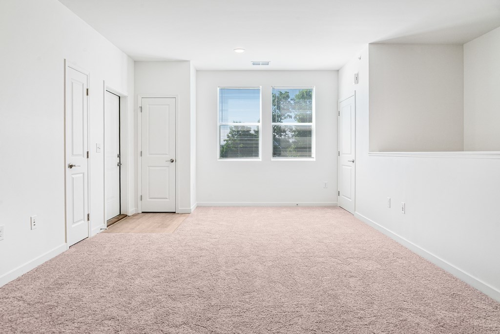 Carpeted Living Area at Union at Oak Grove, Howell, MI