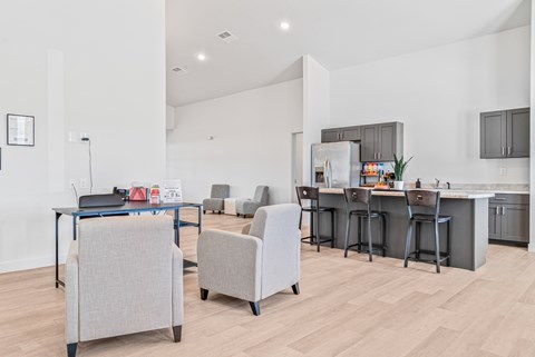 A modern kitchen with a dining table and chairs.