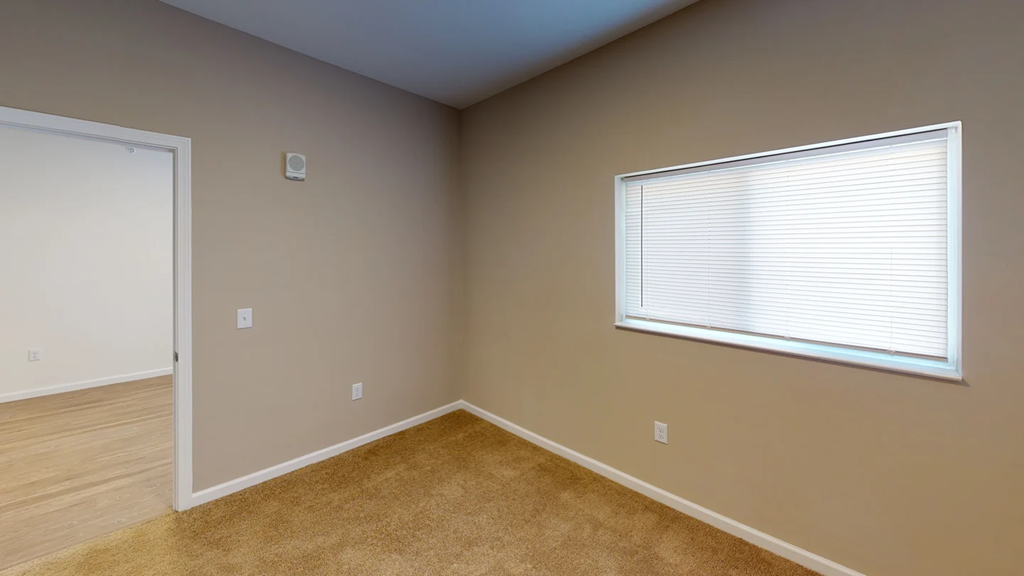 A room with a window and a door.at Union at 16th, Indianapolis