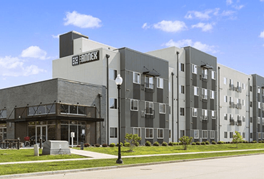 a large building with a street in front of it