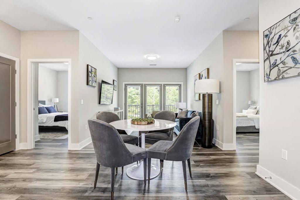 a dining room with a table and chairs