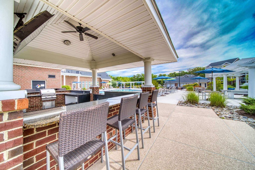 Poolside grilling station with TV at Meridian Obici, Virginia