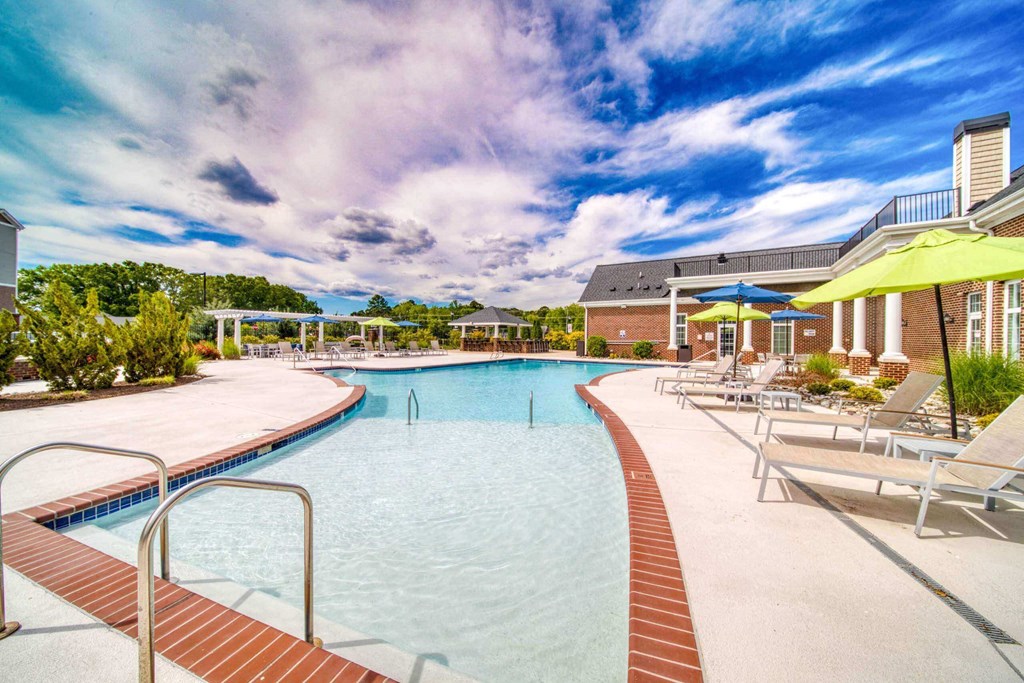 a large swimming pool with sun shelf at Meridian Obici, Suffolk Virginia