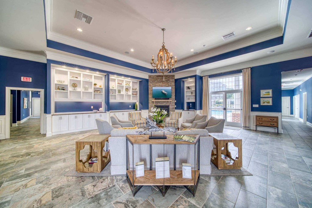 the lobby area with couch and tv at Meridian Obici, Suffolk, VA 23434