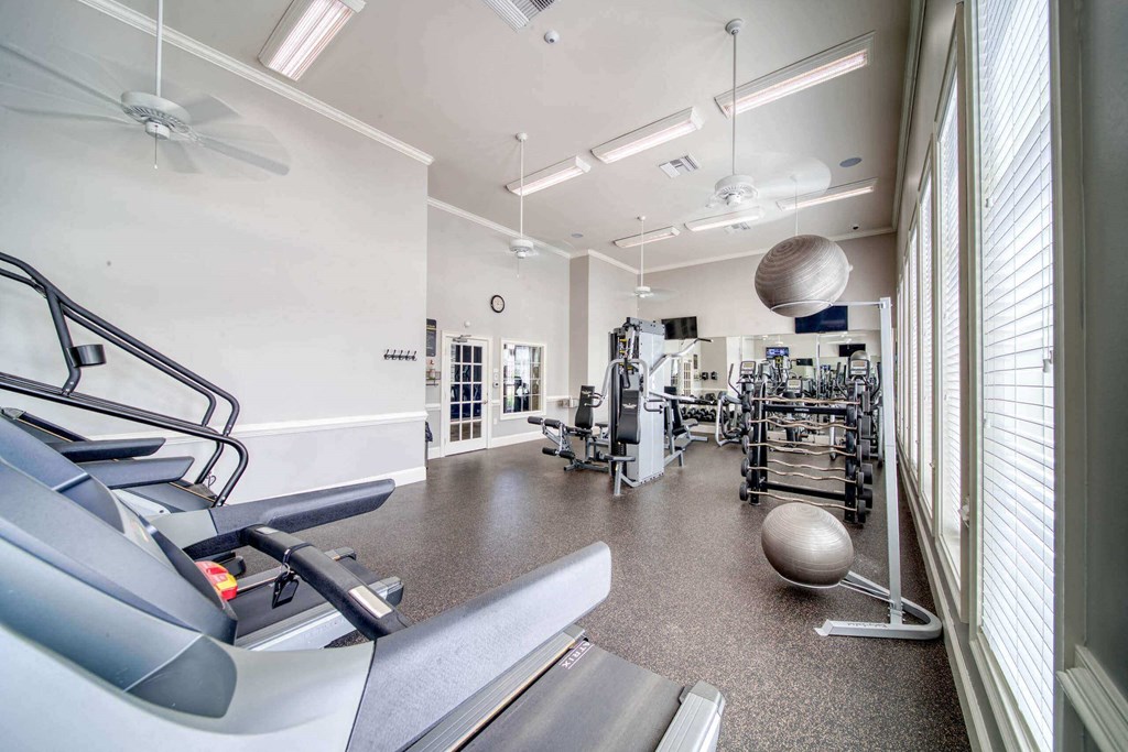 a large fitness room with treadmills and other exercise equipment at Meridian Obici, Suffolk Virginia
