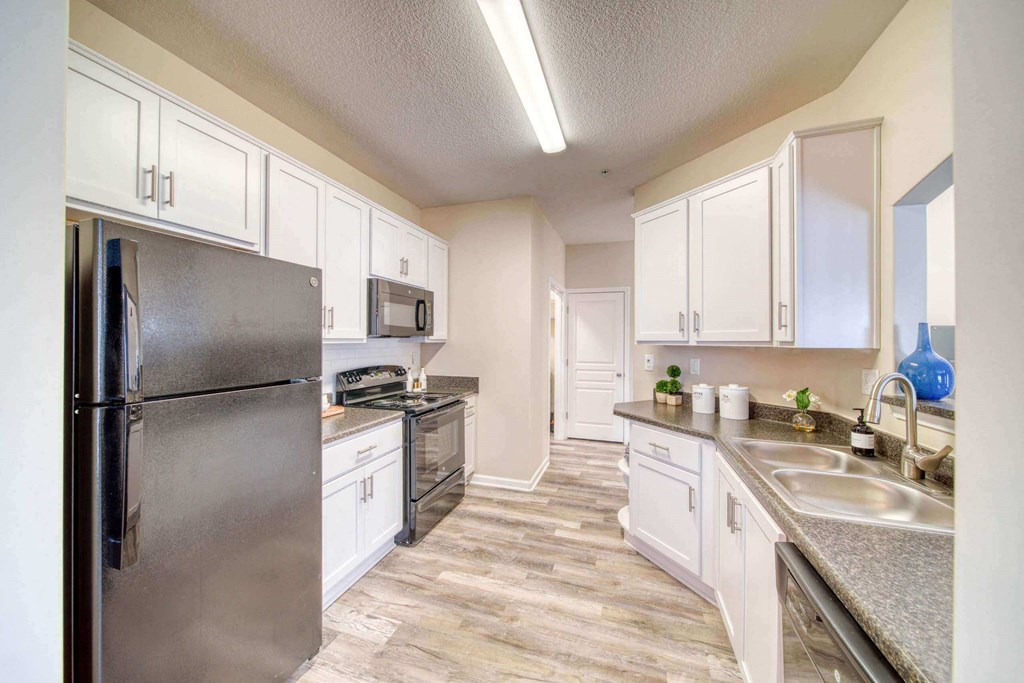 a kitchen with stainless steel appliances at Meridian Obici, Suffolk