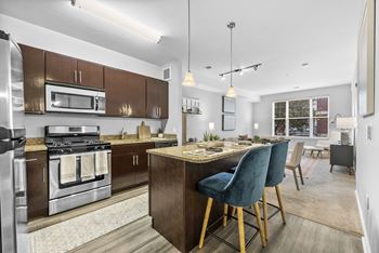 a kitchen and dining area in a 555 waverly unit  at Harbor Pointe, Bayonne, New Jersey