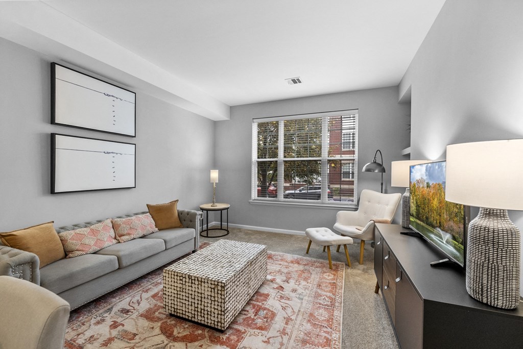 a spacious living room with a large window  at Harbor Pointe, Bayonne, New Jersey
