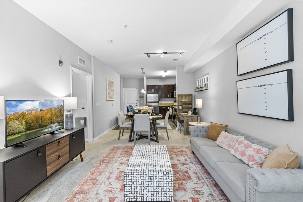a living room with a couch and a tv at Harbor Pointe, Bayonne, New Jersey