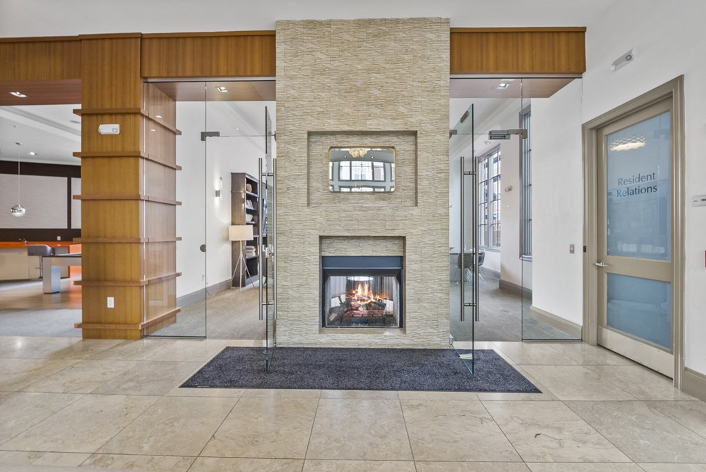 a fireplace in the center of the lobby  at Harbor Pointe, New Jersey, 07002