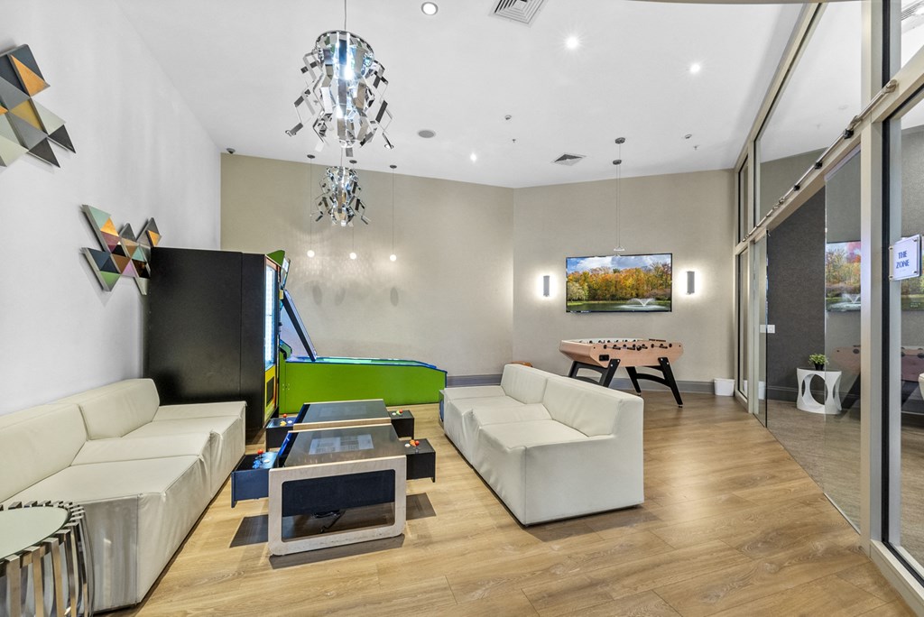 a games room with a foosball table and mini bowling at Harbor Pointe, Bayonne