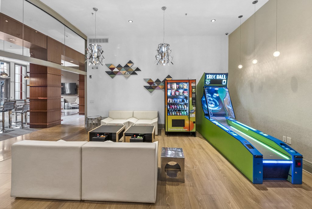 a games room with a foosball table and mini bowling at Harbor Pointe, Bayonne