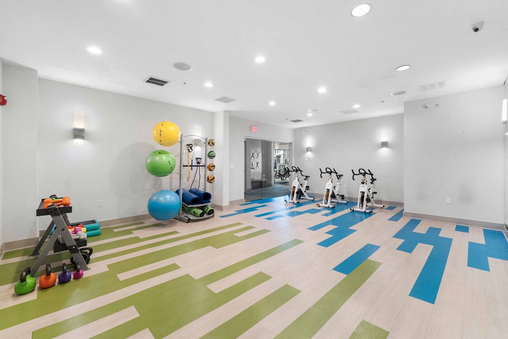 a spacious fitness center with treadmills and other exercise equipment  at The Lena, New Jersey