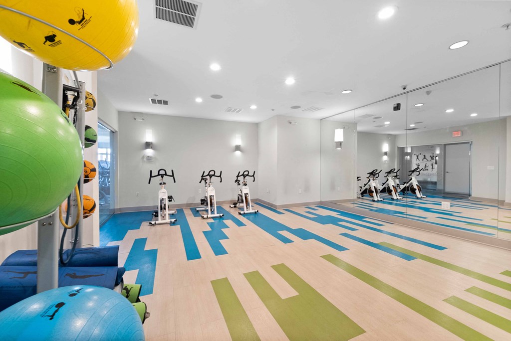 a spacious fitness center and yoga studio at The Lena, New Jersey