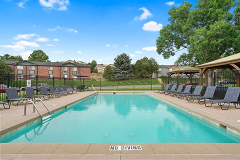A pool with a NO DIVING sign in the foreground at Mountain Vista Apartments, Colorado, 80228