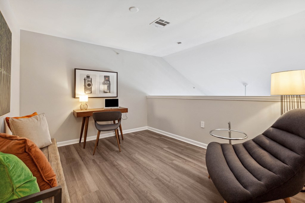 a bedroom with a desk and chair in a 555 waverly unit at Metro 303, Hempstead