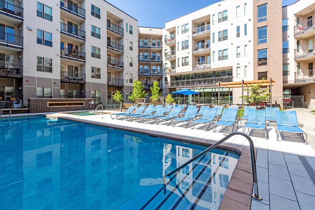 A swimming pool in front of apartment buildings at Regatta Sloans Lake Apartments, Denver