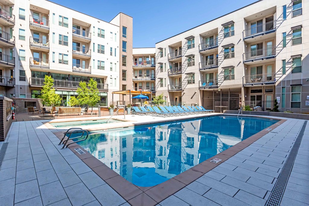 A large swimming pool in front of apartment buildings at Regatta Sloans Lake Apartments, Denver, 80204