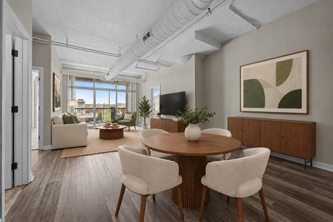A modern dining room with a wooden table and chairs.