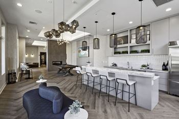 a living room with a kitchen and a dining room at West 130, New York