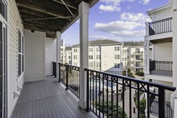a balcony with a view of a building and a balcony fence at West 130, New York