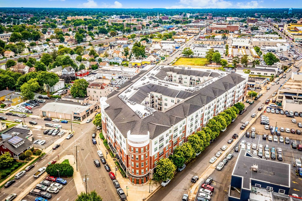 an aerial view of a large brick building with a black roof at Metro 303, New York