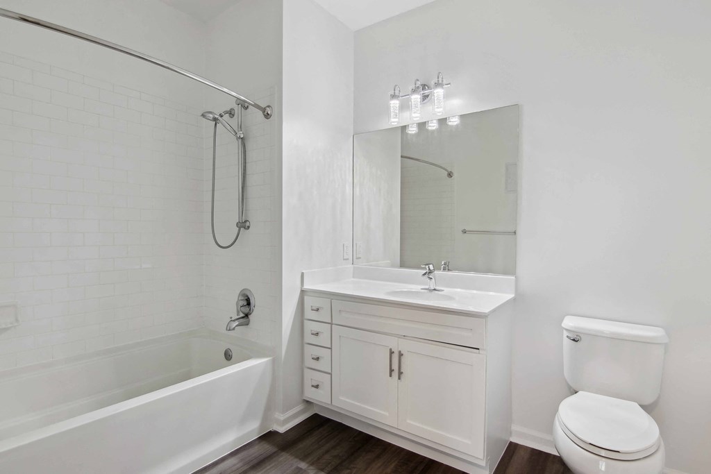 a bathroom with a toilet sink and bathtub at Metro 303, New York