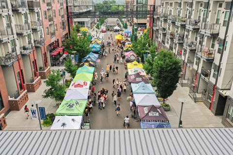 A street market with many people walking around at Regatta Sloans Lake Apartments, Denver, 80204