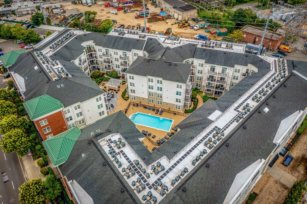 an aerial view of a large apartment complex with a swimming pool at West 130, West Hempstead New York