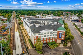 an aerial view of a building in a city at West 130, West Hempstead