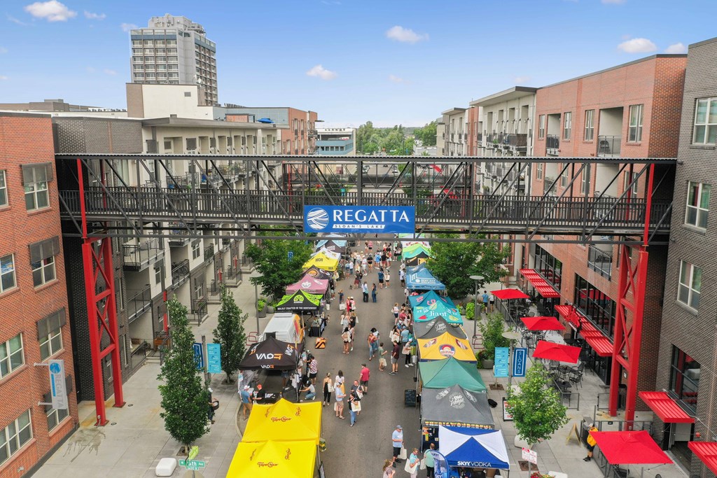 A busy street with a sign at Regatta Sloans Lake Apartments, Denver