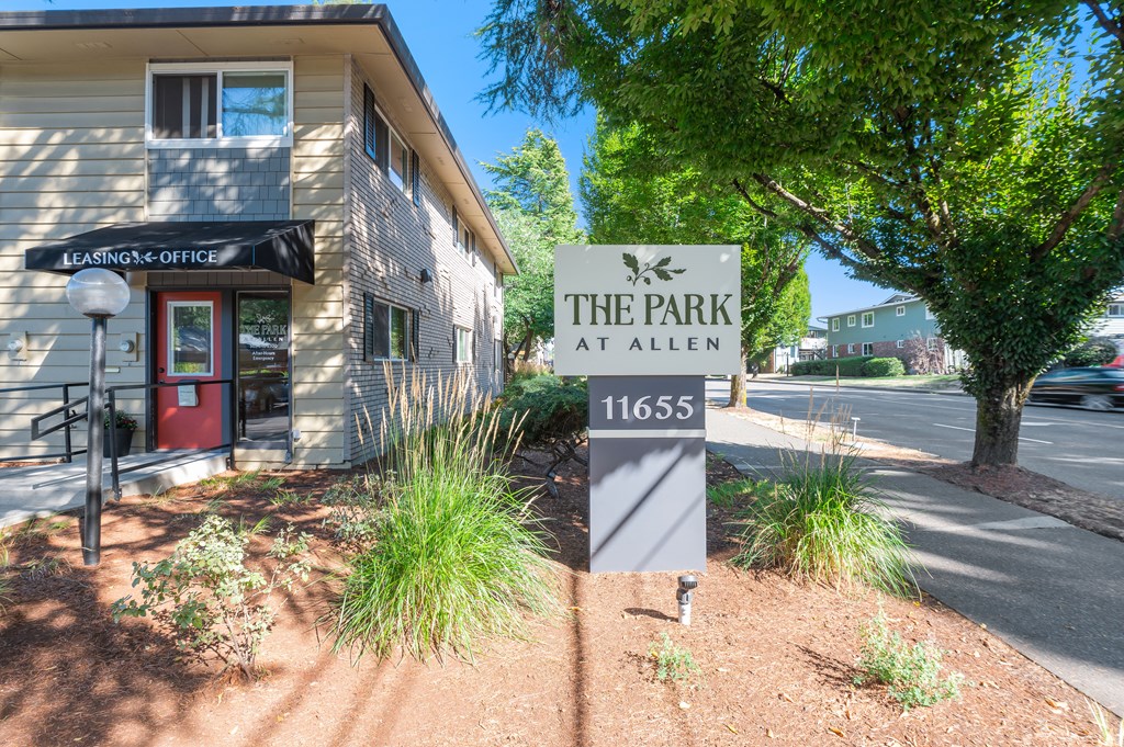 the park at allen sign in front of a building