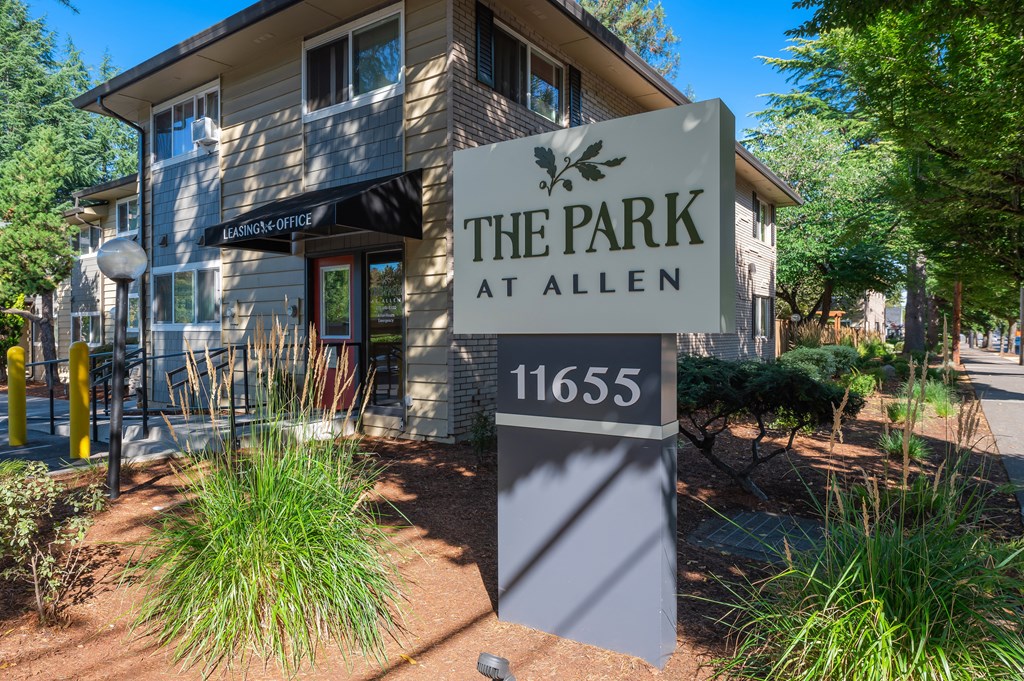 the park at allen sign in front of a building