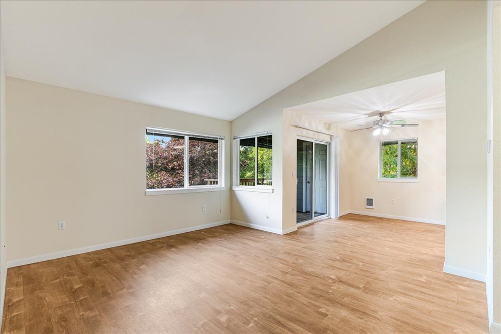 Cascade Woods living area with sliding glass door and natural light