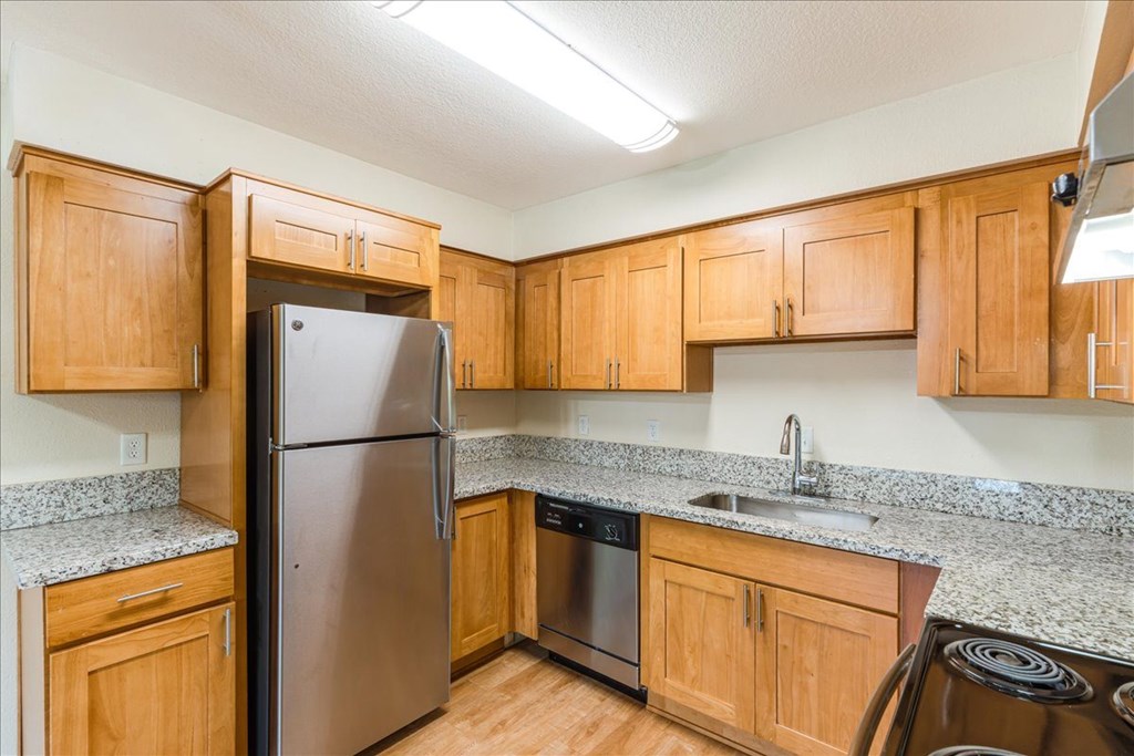 Cascade Woods kitchen area with fridge and dishwasher