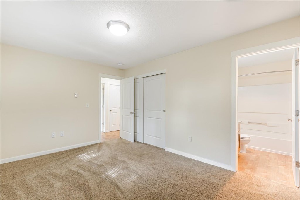 Cascade Woods bedroom with sliding closet door