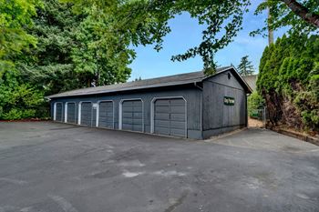 a large garage with a row of garages on the side of it
