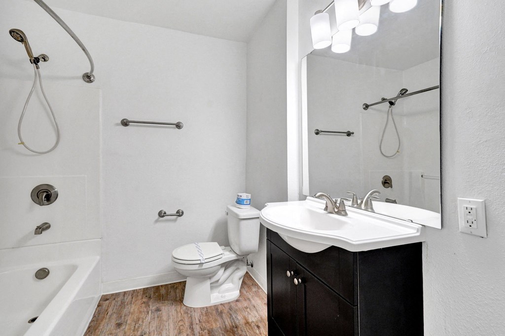 a bathroom with a toilet sink and bathtub