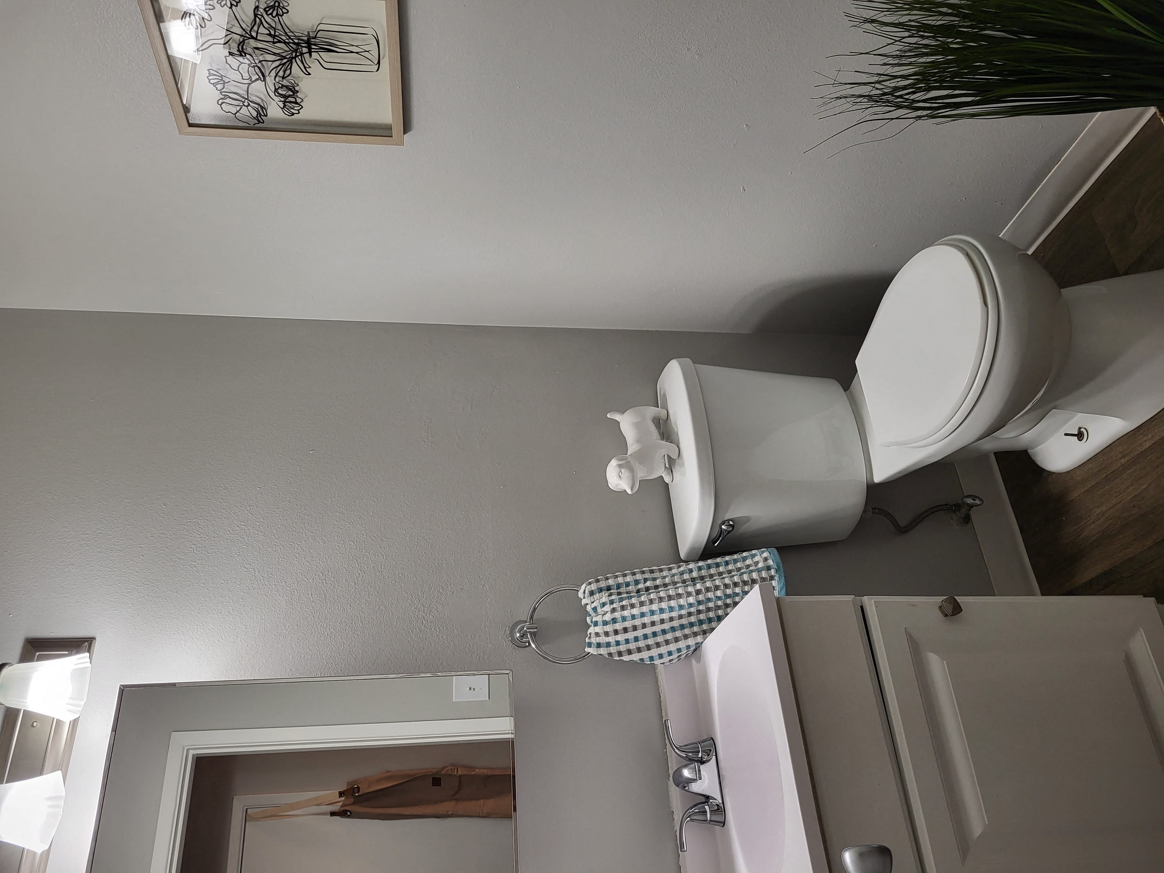 a small bathroom with a sink and a toilet and a cabinet