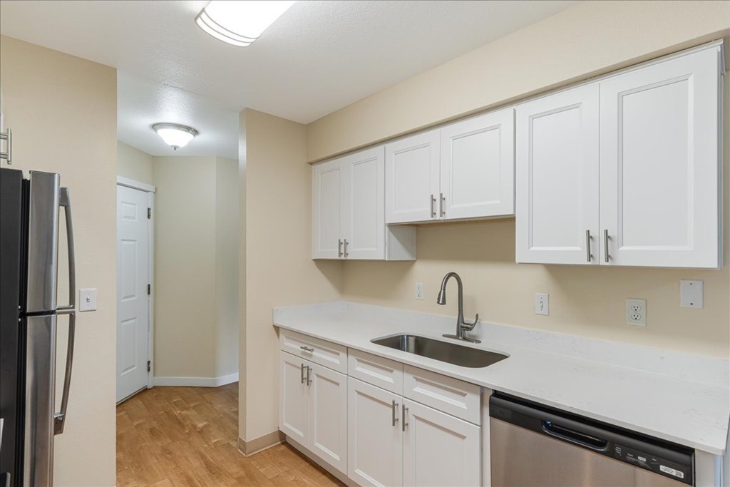 Cascade Woods kitchen area with sink and dishwasher