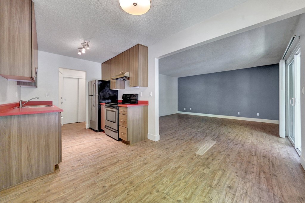 a kitchen and living room in a 555 waverly unit