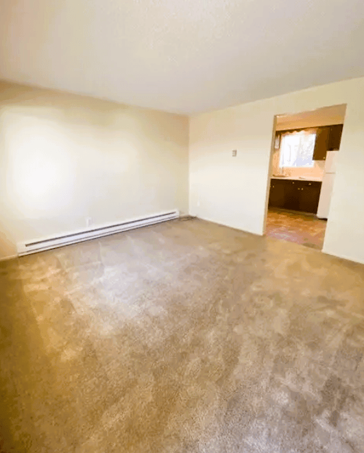 Nell Anna Court room with a light brown floor and white walls.