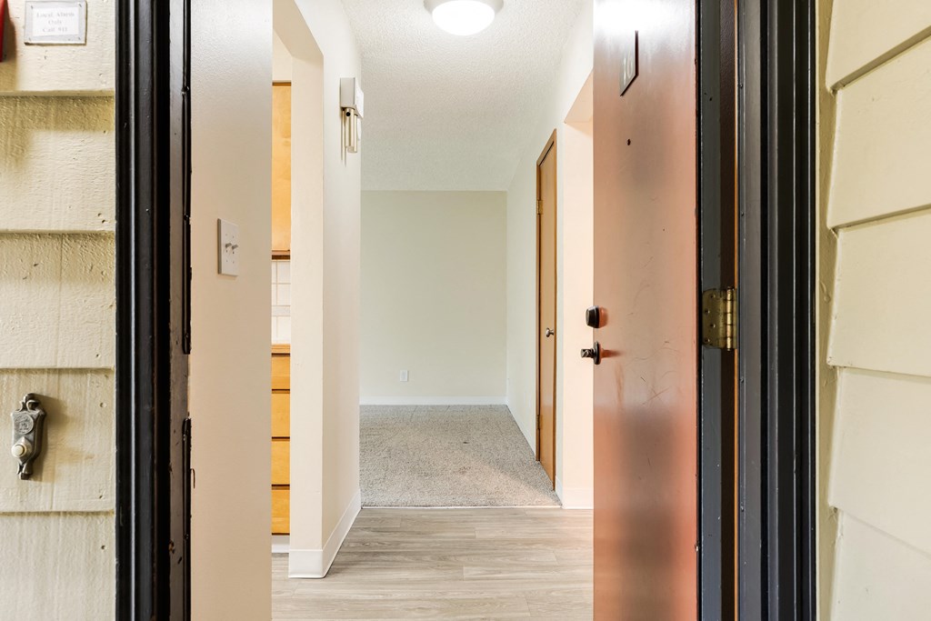 a view of the living room from the doorway of a renovated house